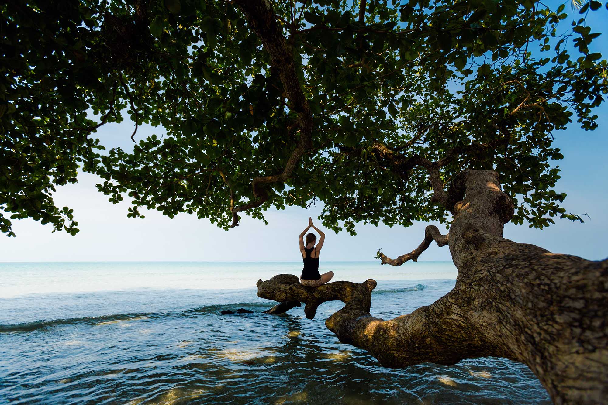 Yoga session on tropical beach